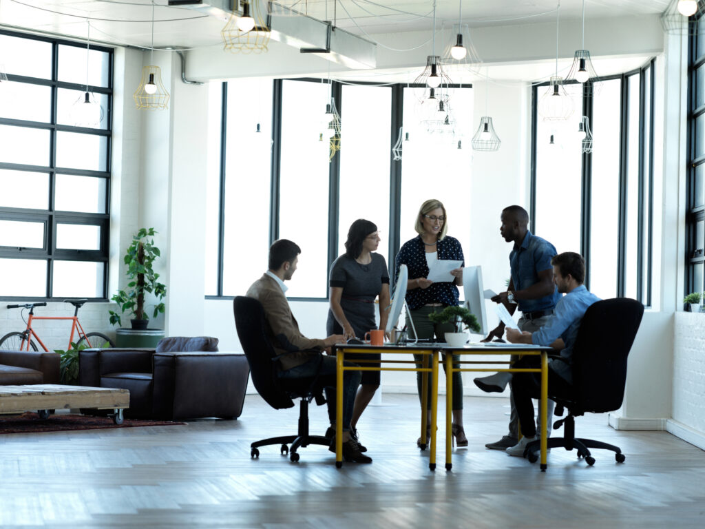 A diverse team brainstorming, capturing the energy and collaboration behind jobs in marketing.